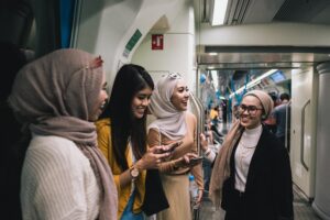 Group of women on a bus talking and laughing