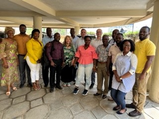 Members of the LPDA field team standing together outside for a picture and smiling.