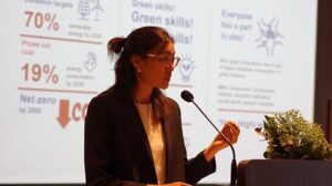 Woman presenting at a podium